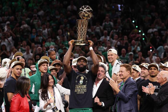 BOSTON, MASSACHUSETTS - JUNE 17: Jaylen Brown #7 of the Boston Celtics holds up the Larry O'Brien trophy after Boston's 106-88 win against the Dallas Mavericks in Game Five of the 2024 NBA Finals at TD Garden on June 17, 2024 in Boston, Massachusetts. NOTE TO USER: User expressly acknowledges and agrees that, by downloading and or using this photograph, User is consenting to the terms and conditions of the Getty Images License Agreement. Elsa/Getty Images/AFP (Photo by ELSA / GETTY IMAGES NORTH AMERICA / AFP)