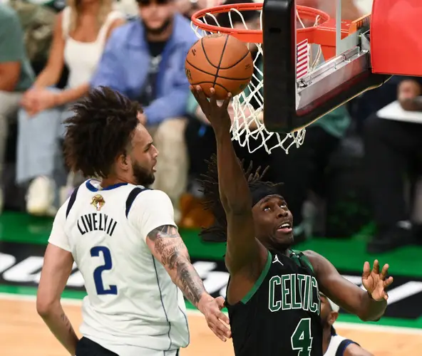 Game 2: The Boston Celtics' Jrue Holiday (4) attempts a layup against the Dallas Mavericks.