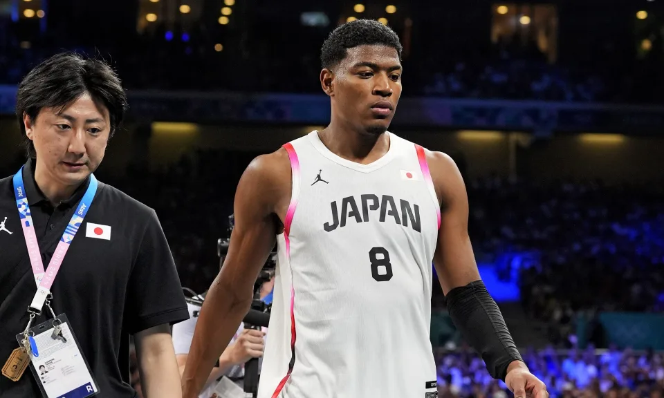 Jul 30, 2024; Villeneuve-d'Ascq, France; Japan small forward Rui Hachimura (8) walks off the court after being disqualified for a second unsportsmanlike foul against France in men’s basketball group B play during the Paris 2024 Olympic Summer Games at Stade Pierre-Mauroy. Mandatory Credit: John David Mercer-USA TODAY Sports