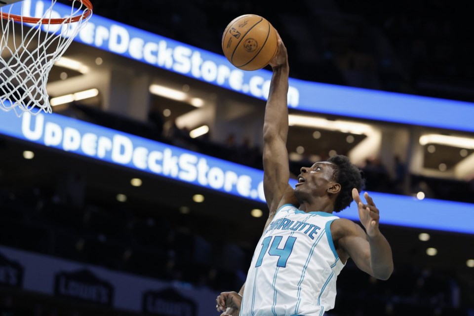 Charlotte Hornets forward Moussa Diabate (14) drives to the basket during the first half of an NBA basketball game against the Milwaukee Bucks in Charlotte, N.C., Wednesday, Feb. 5, 2025. (AP Photo/Nell Redmond)