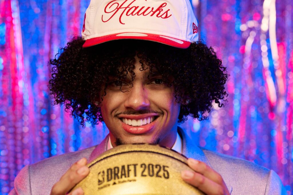 Asa Newell with the Hawks hat