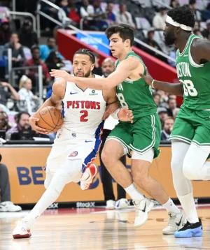 Detroit Pistons guard Cade Cunningham (2) drives past Boston Celtics guard Hugo González (28) in the first quarter.