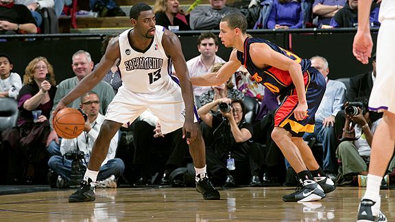 Tyreke Evans & Stephen Curry. Rocky Widner / Getty Images