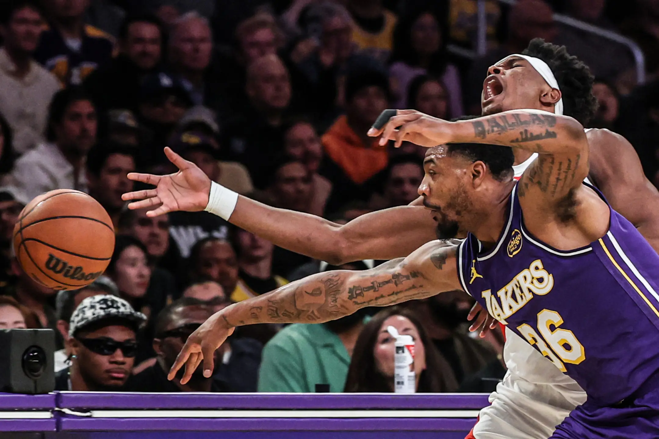 Lakers guard Marcus Smart knocks the ball away from Rockets guard Amen Thompson during Game 5 at Crypto.com Arena on Wednesday. (Robert Gauthier / Los Angeles Times)